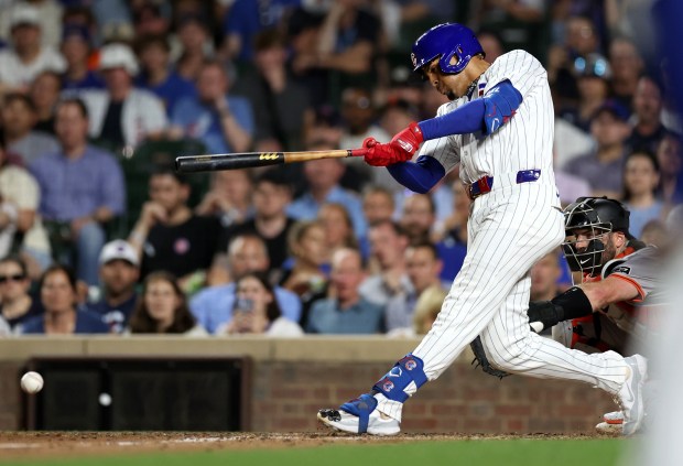 Chicago Cubs hitter Christopher Morel (5) drives in a run on an infield single in the 8th inning of a game against the San Francisco Giants at Wrigley Field in Chicago on June 18, 2024. (Chris Sweda/Chicago Tribune)