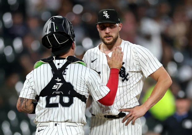 Chicago White Sox catcher Korey Lee and starting pitcher Garrett Crochet talk on the mound in the sixth inning of a game against the Houston Astros at Guaranteed Rate Field in Chicago on June 19, 2024. (Chris Sweda/Chicago Tribune)