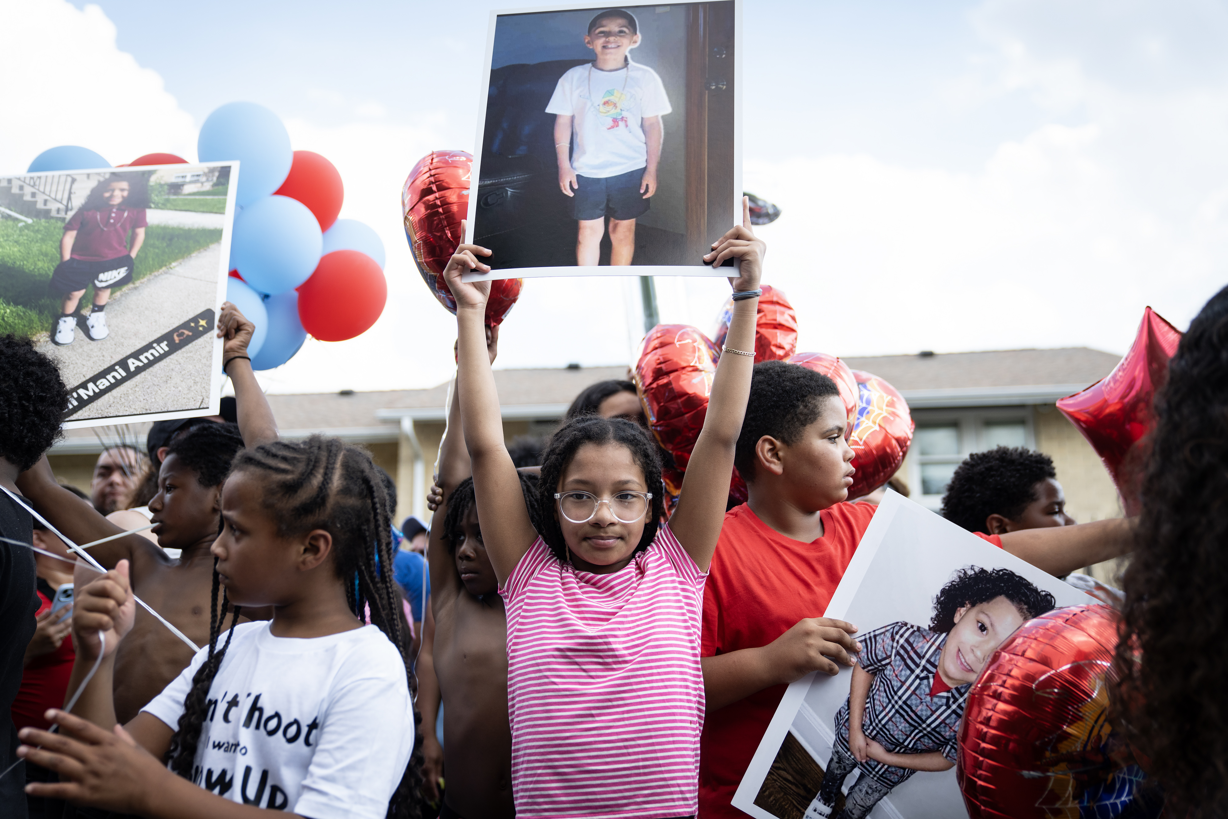 Children gather during a vigil on June 19, 2024, for...