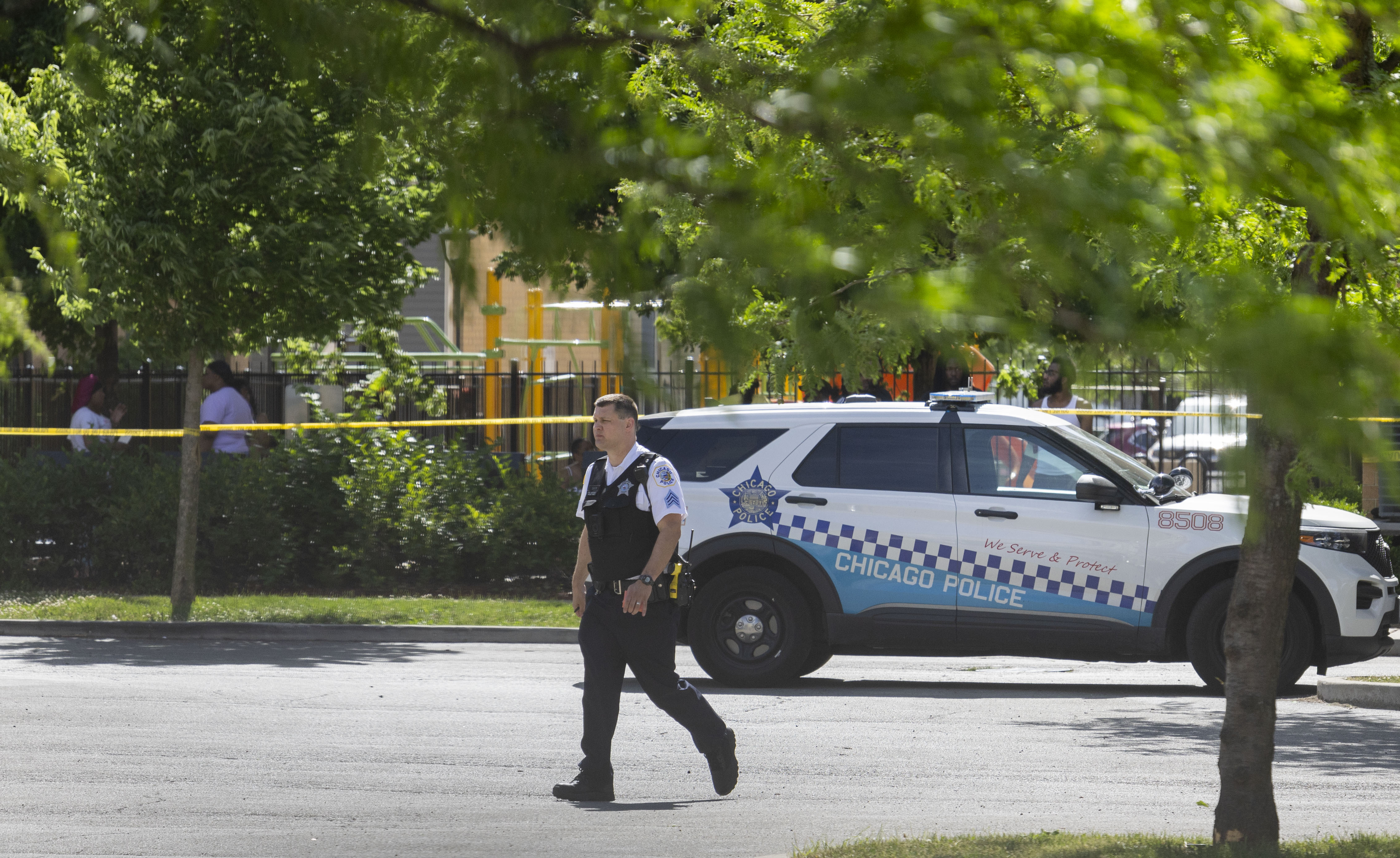 Chicago police work a scene on Tuesday, June 18, 2024,...