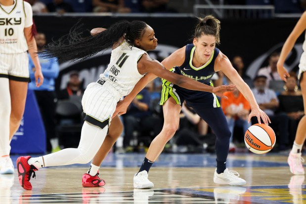 Chicago Sky guard Dana Evans (11) tries to get the ball from Dallas Wings guard Sevgi Uzun (1) during the game at Wintrust Arena on June 20, 2024. (Eileen T. Meslar/Chicago Tribune)