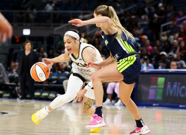 Chicago Sky guard Chennedy Carter (7) tries to get past Dallas Wings guard Jacy Sheldon (4) during the game at Wintrust Arena on June 20, 2024. (Eileen T. Meslar/Chicago Tribune)