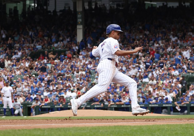 Cubs third baseman Christopher Morel rounds third base for home on an RBI double by shortstop Dansby Swanson in the first inning against the Mets at Wrigley Field on June 22, 2024, in Chicago. (John J. Kim/Chicago Tribune)
