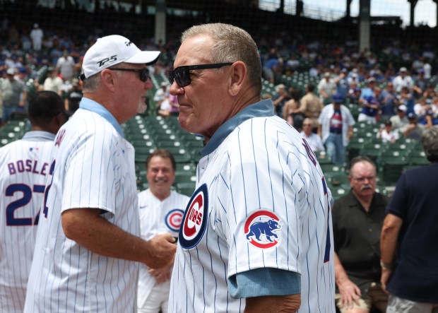 Former Cubs player Jody Davis, center, mingles with former teammates to be recognized as part of the 1984 Cubs before a game against the Mets at Wrigley Field on June 22, 2024, in Chicago. (John J. Kim/Chicago Tribune)