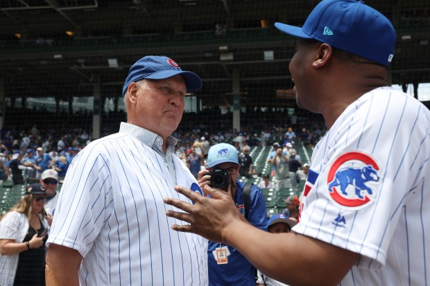 Former Cubs player Ryne Sandberg, left, and comedian Roy Wood Jr. talk before a game against the Mets at Wrigley Field on June 22, 2024, in Chicago. (John J. Kim/Chicago Tribune)