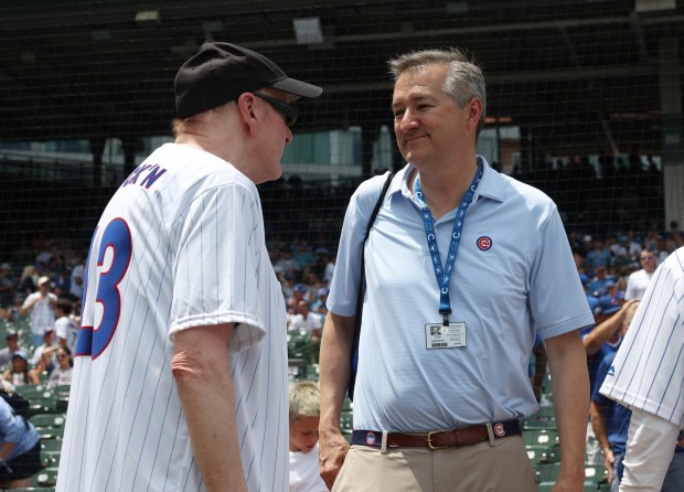 Rick Nielsen of the band Cheap Trick, left, and Cubs chairman Tom Ricketts talk before a game between the Cubs and Mets at Wrigley Field on June 22, 2024, in Chicago. (John J. Kim/Chicago Tribune)