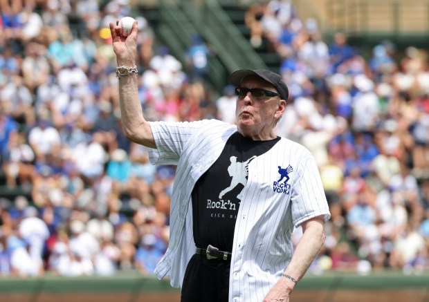Rick Nielsen of the band Cheap Trick throws out a ceremonial first pitch before a game between the Cubs and Mets at Wrigley Field on June 22, 2024, in Chicago. (John J. Kim/Chicago Tribune)
