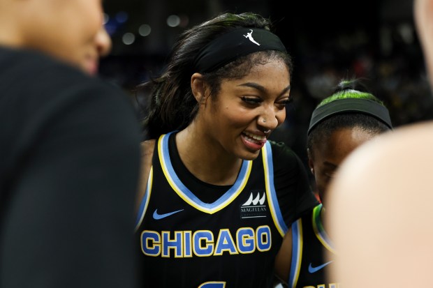 Chicago Sky forward Angel Reese (5) smiles in her team huddle after defeating the Indiana Fever 88-87 at Wintrust Arena on June 23, 2024. (Eileen T. Meslar/Chicago Tribune)