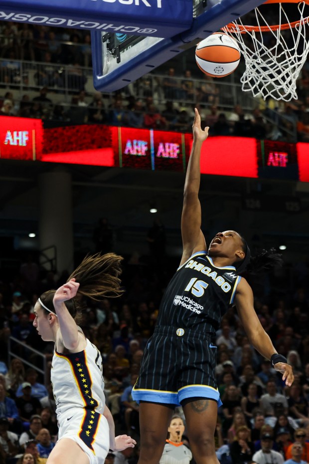 Chicago Sky guard Lindsay Allen (15) scores while guarded by Indiana Fever guard Caitlin Clark (22) during the game at Wintrust Arena on June 23, 2024. (Eileen T. Meslar/Chicago Tribune)