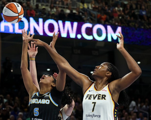 Chicago Sky forward Angel Reese (5) and Indiana Fever forward Aliyah Boston (7) battle for the ball during the game against at Wintrust Arena on June 23, 2024. (Eileen T. Meslar/Chicago Tribune)