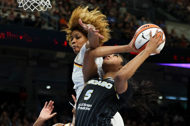 Indiana Fever forward NaLyssa Smith (1) fouls Chicago Sky forward Angel Reese (5) during the game at Wintrust Arena on June 23, 2024. (Eileen T. Meslar/Chicago Tribune)