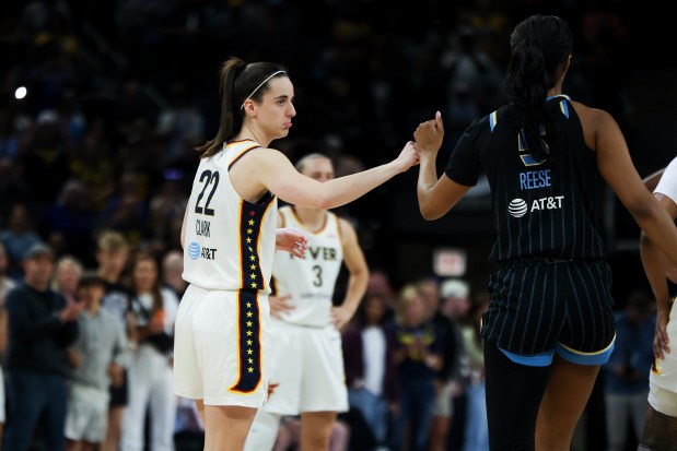 Indiana Fever guard Caitlin Clark (22) fist bumps Chicago Sky forward Angel Reese (5) before the game at Wintrust Arena on June 23, 2024. (Eileen T. Meslar/Chicago Tribune)