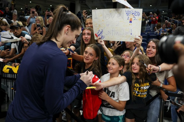 Indiana Fever guard Caitlin Clark signs autographs for fans before the game against the Chicago Sky at Wintrust Arena on June 23, 2024. (Eileen T. Meslar/Chicago Tribune)