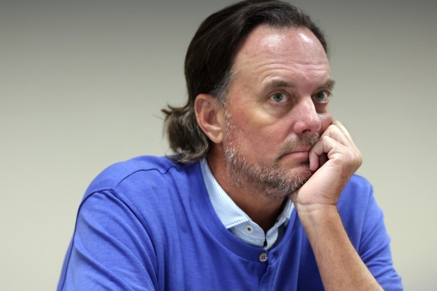 Dan Proft listens April 29, 2024, during a hearing of the State Board of Elections after Illinois Democrats filed a complaint against the GOP strategist and right-wing radio talk show host for alleged illegal election coordination with former GOP gubernatorial nominee Darren Bailey. (Stacey Wescott/Chicago Tribune)