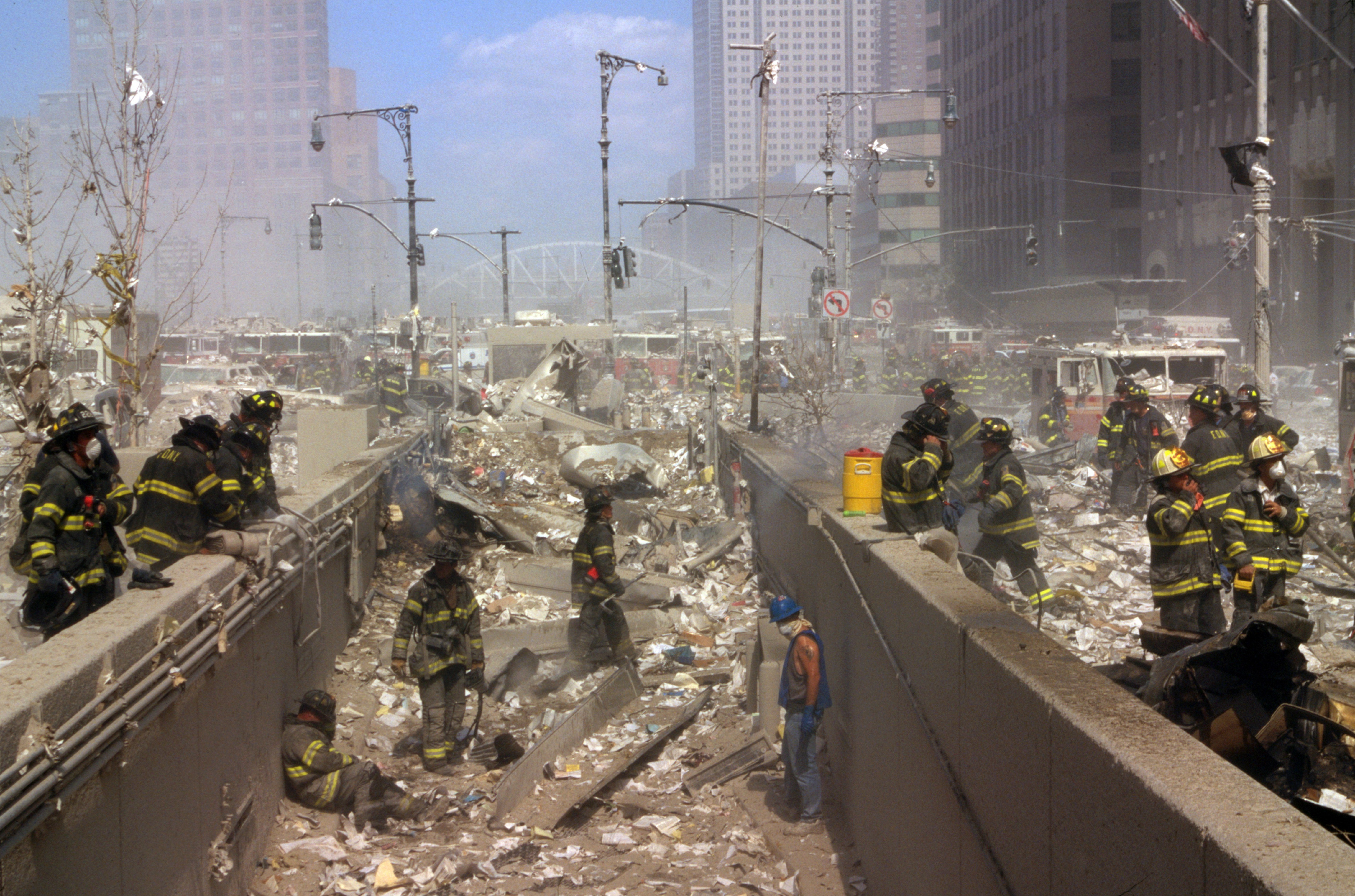New York firefighters amid the rubble of the World Trade Centre following the 9/11 attacks.