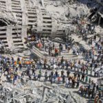 Rescue workers sift through the wreckage of the World Trade Center September 13, 2001.