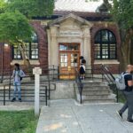 People idling outside of the St. George Library on Staten Island.