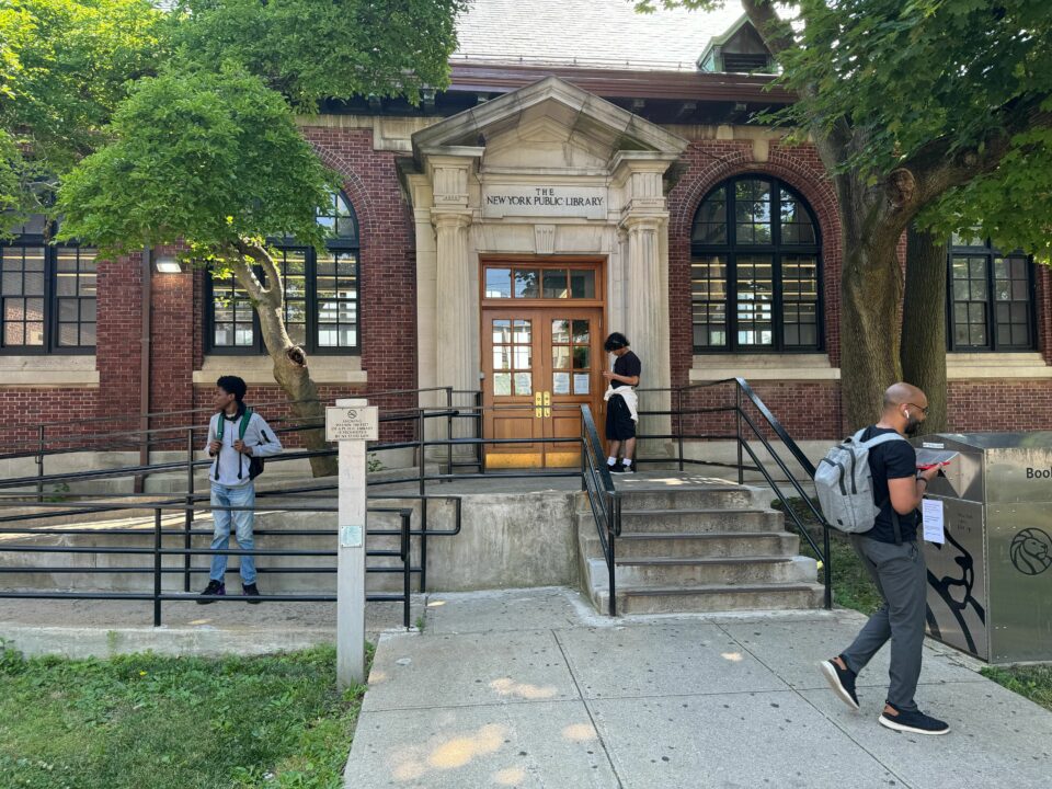 People idling outside of the St. George Library on Staten Island.