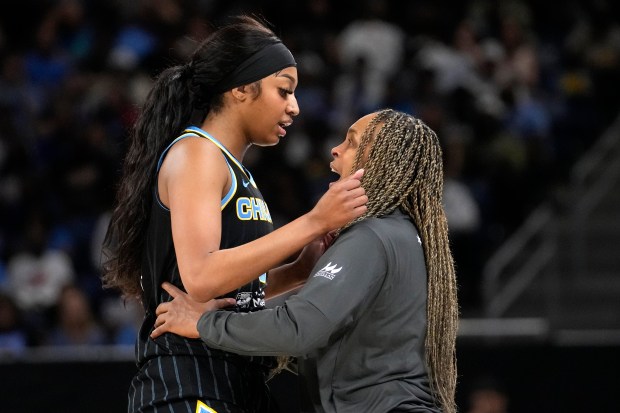 Chicago Sky head coach Teresa Weatherspoon talks to Angel Reese during the second half of a WNBA basketball game against the New York Liberty Tuesday, June 4, 2024, in Chicago. (AP Photo/Charles Rex Arbogast)