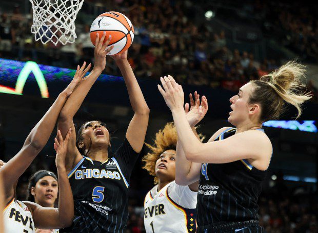 Chicago Sky forward Angel Reese (5) and guard Marina Mabrey (4) battle Indiana Fever forward Aliyah Boston (7) and Indiana Fever forward NaLyssa Smith (1) for a rebound during the game at Wintrust Arena on June 23, 2024. (Eileen T. Meslar/Chicago Tribune)