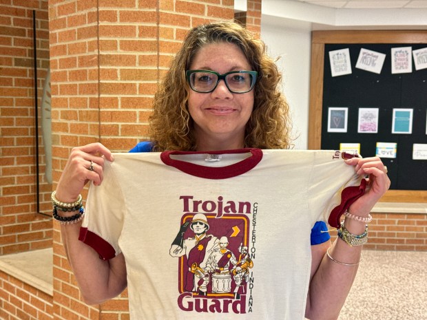 Tina Carey, class of 1990, shows her Chesterton High School Trojan Guard marching band T-shirt during a final tour of the school on Saturday, June 1, 2024. The school closed at the end of May. (Doug Ross/for Post-Tribune)