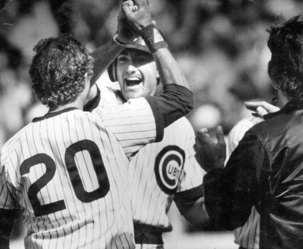 Dave Owen, center, whoops it up with Bob Dernier after Owen's pinch-hit, bases-loaded RBI single in the 11th inning that gave the Cubs a 12-11 victory over the Cardinals at Wrigley Field on June 23,1984. (Charles Cherney/Chicago Tribune)