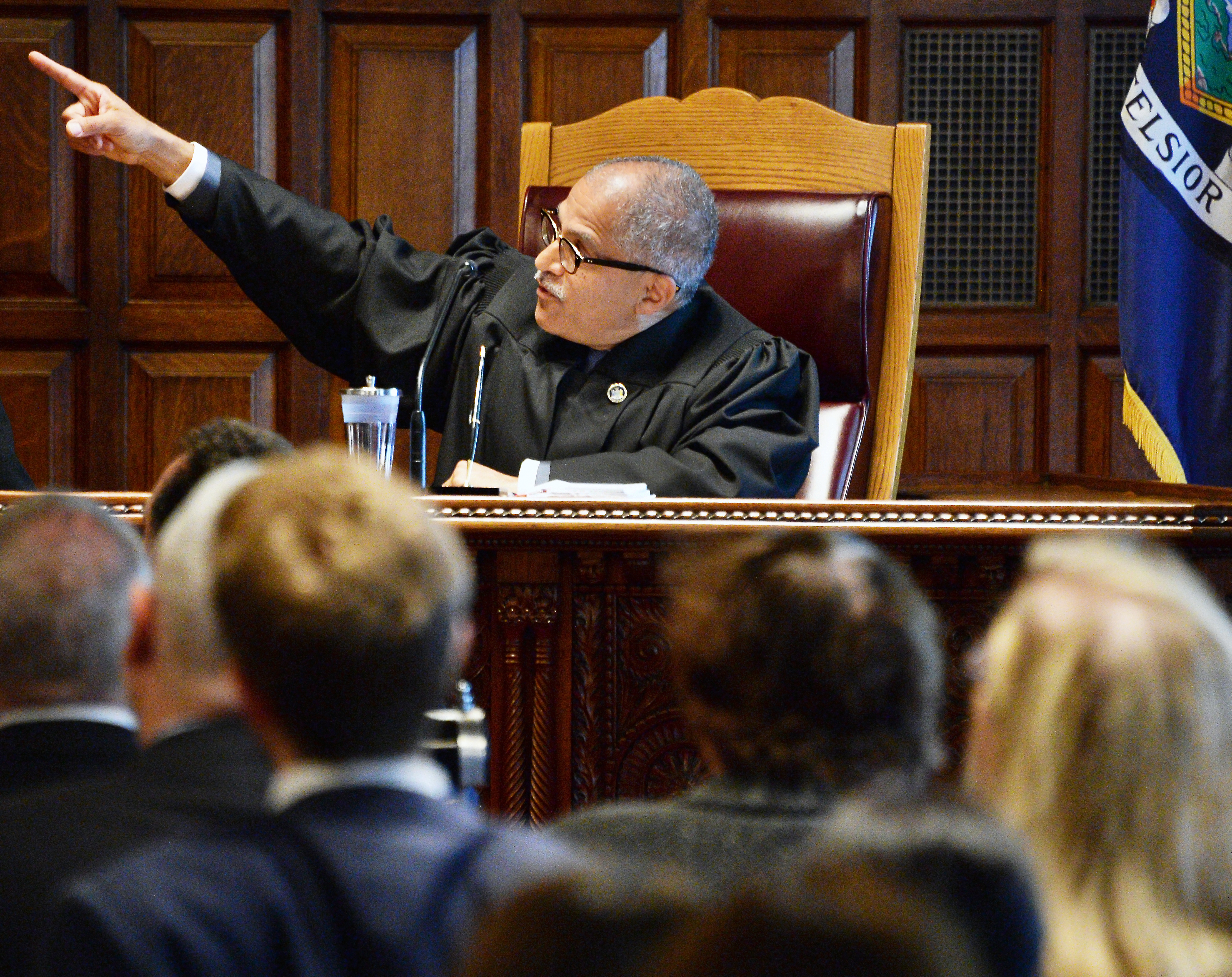 Albany Times Union New Court of Appeals Judge Rowan Wilson points to portraits of past justices speaking during his swearing in ceremony Thursday June 1, 2017 in Albany, NY.