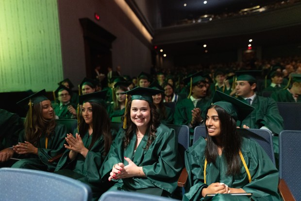 The Glenbrook North Class of 2024 applaud during their graduation ceremony in Rosemont Theatre on Sunday, June 2, 2024. (Troy Stolt/for the Pioneer Press)