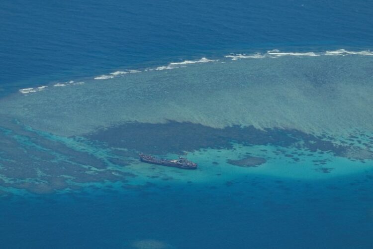 FILE PHOTO: Philippine Coast Guard flyby over the South China Sea