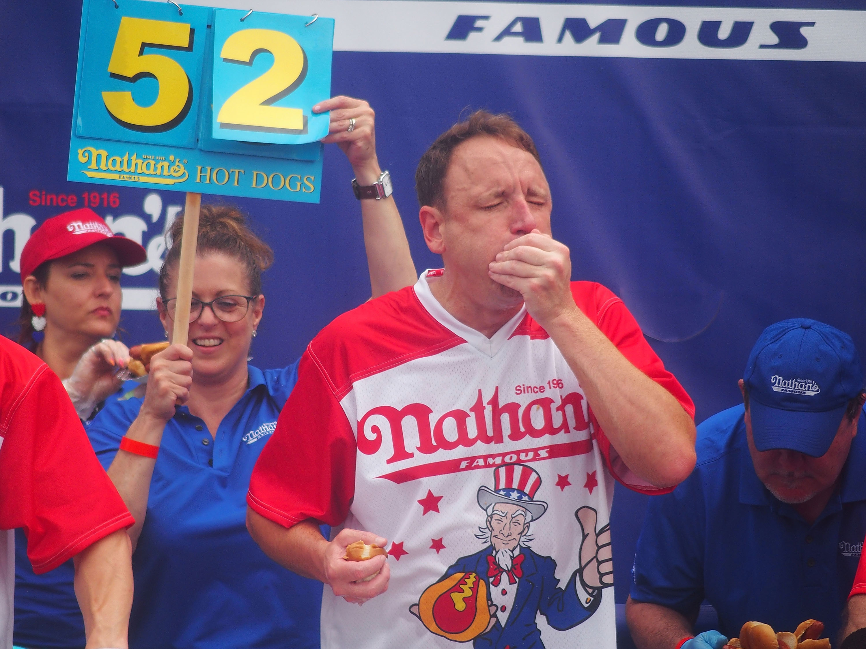 Defending champion Joey Chestnut competes in the 2023 Nathan's Famous International Hot Dog Eating Contest at Coney Island on July 4, 2023 in New York City.