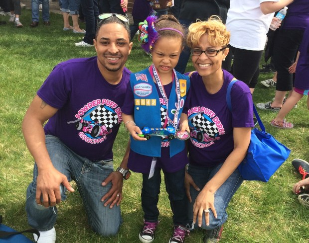 Malik, Zoe and Jeneya Hampton, of Matteson, gather for a photo at a Scouting event in 2015. While Jeneya Hampton has long been Zoe's Girl Scout troop leader, Malik has taken an active role as well. (Hampton family photo)