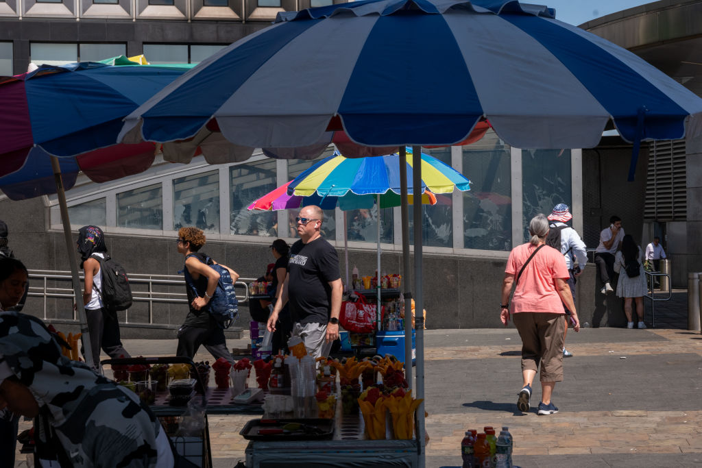 People walk in Lower Manhattan on a warm late spring afternoon on June 3, 2024.