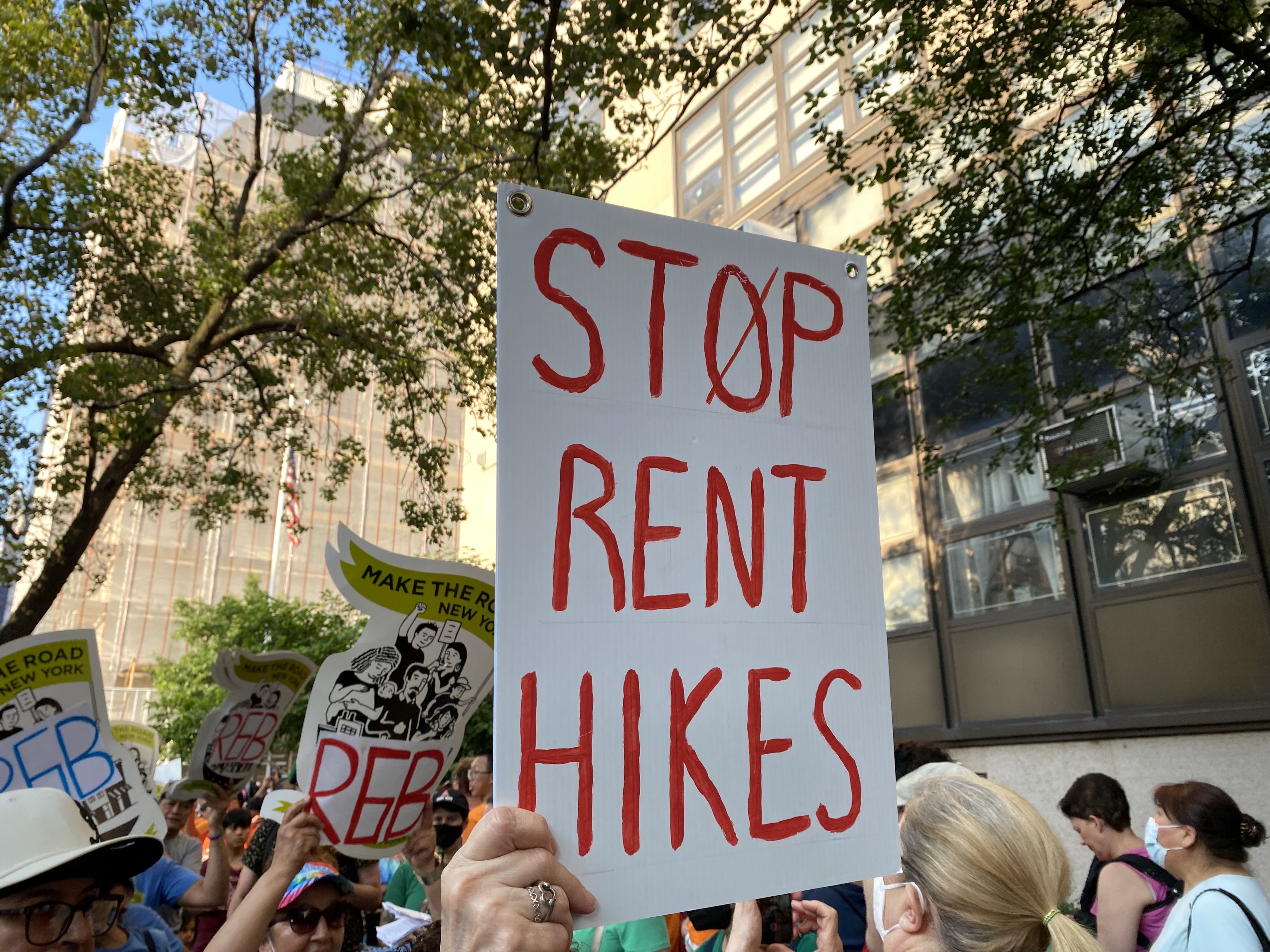 Demonstrators outside of the Rent Guidelines Board meeting hold signs asking for no rent raises this year.