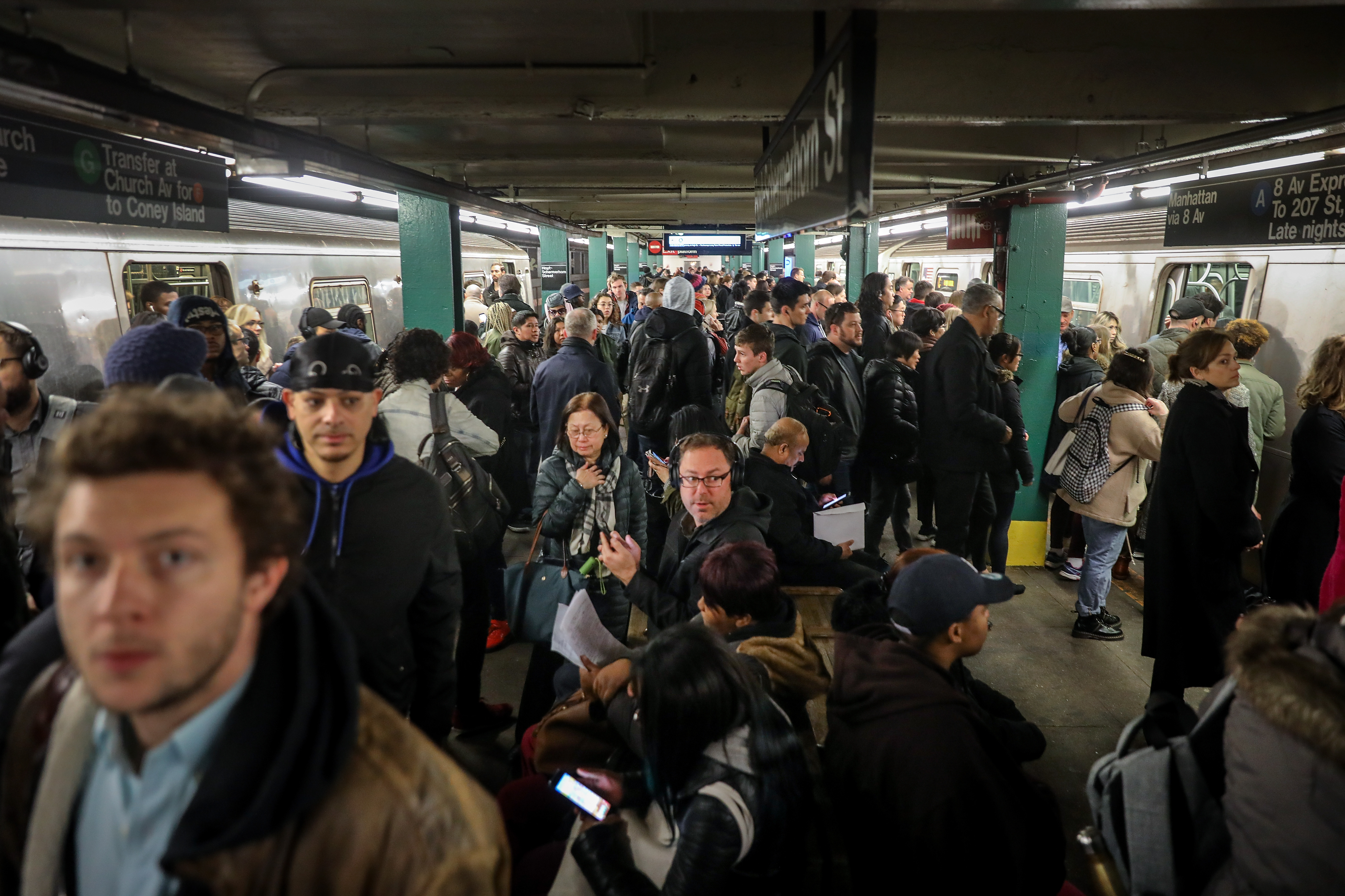 A crowded New York City subway platform.