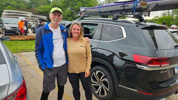 St. Charles Canoe Club members Karl Teske of North Aurora and Jennifer Miksula of Montgomery were among the hundreds who took part Saturday in the 59th Mid-America Canoe and Kayak Race on the Fox River. (David Sharos / For The Beacon-News)