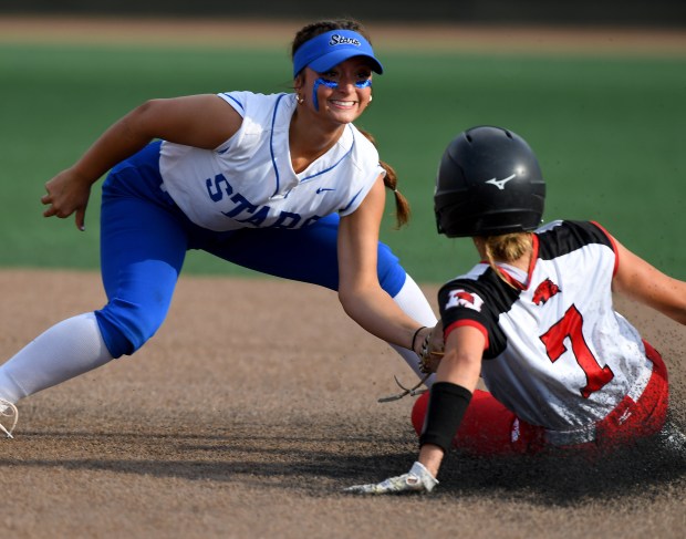 St. Charles North's Ginger Ritter (8) tags out Marist's Jacklyn Pigatto (7) attempting to steal second base. St. Charles North defeated Marist 7-2 in the Class 4A state championship at Louisville Slugger Sports Complex, Saturday, June 8, 2024(Rob Dicker / Daily Southtown)