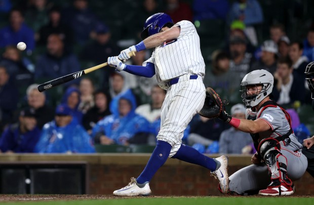 Chicago Cubs shortstop Dansby Swanson (7) hits a 2-run home run in the 8th inning of a game against the Cincinnati Reds at Wrigley Field in Chicago on June 2, 2024. (Chris Sweda/Chicago Tribune)