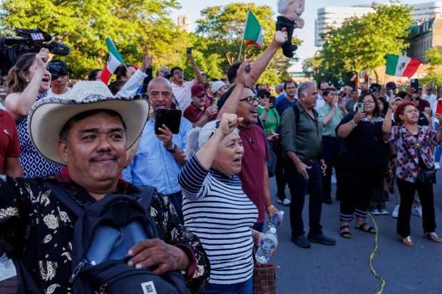 People cheer outside the Mexican Consulate in Chicago after waiting to vote in Mexico's presidential election, June 2, 2024. (Armando L. Sanchez/Chicago Tribune)