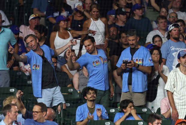 Chicago Cubs fans dance to the YMCA song on Chicago Cubs' Pride Celebration night at Wrigley Field on June 17, 2024, in Chicago. (Stacey Wescott/Chicago Tribune)