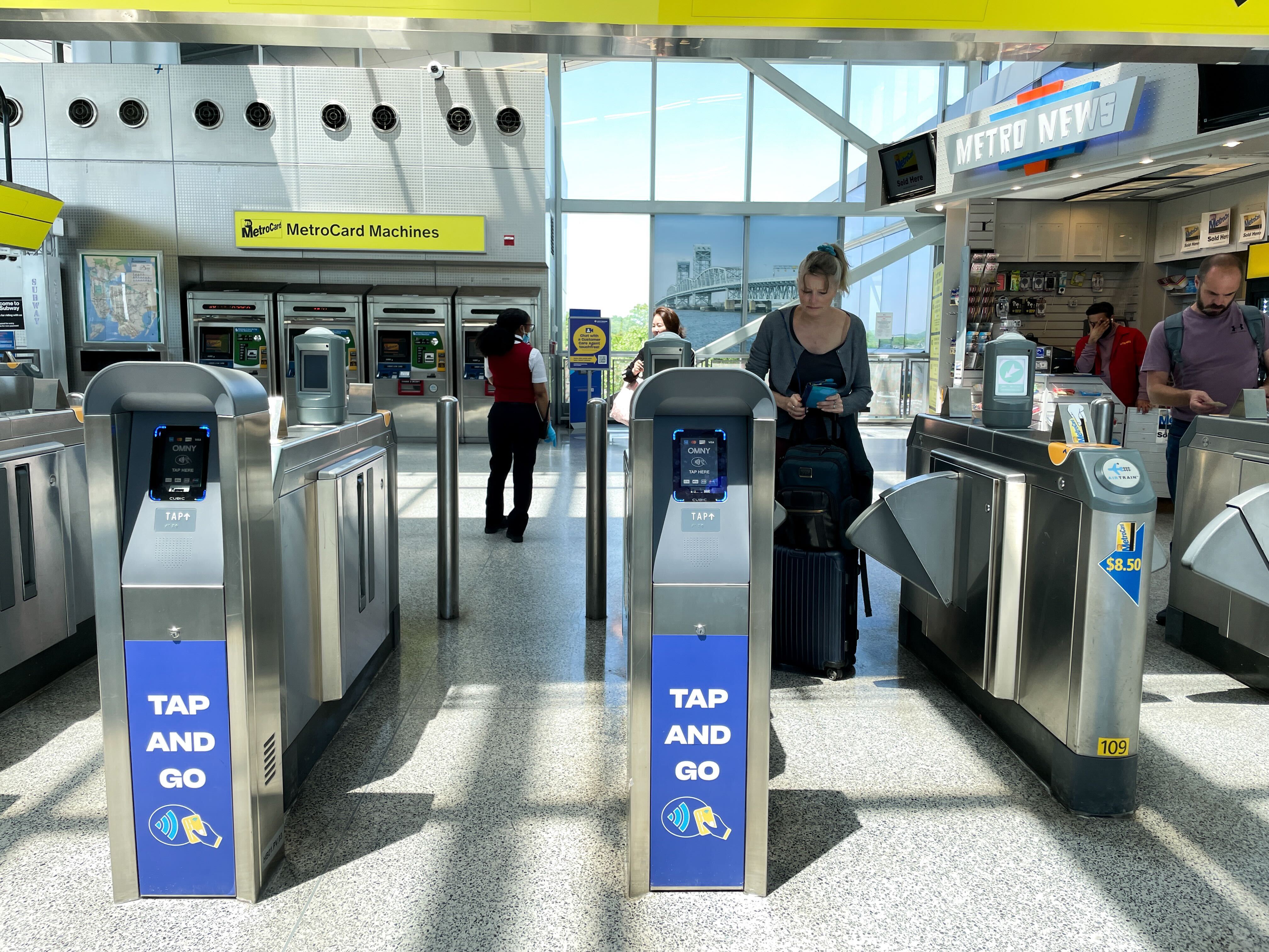 Open turnstiles at JFK airport allow commuters to go between the subway and Airtrain free of charge.