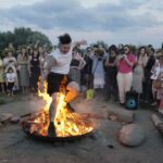 Ukrainians in Warsaw jump over a bonfire, float braids to celebrate solstice custom away from home