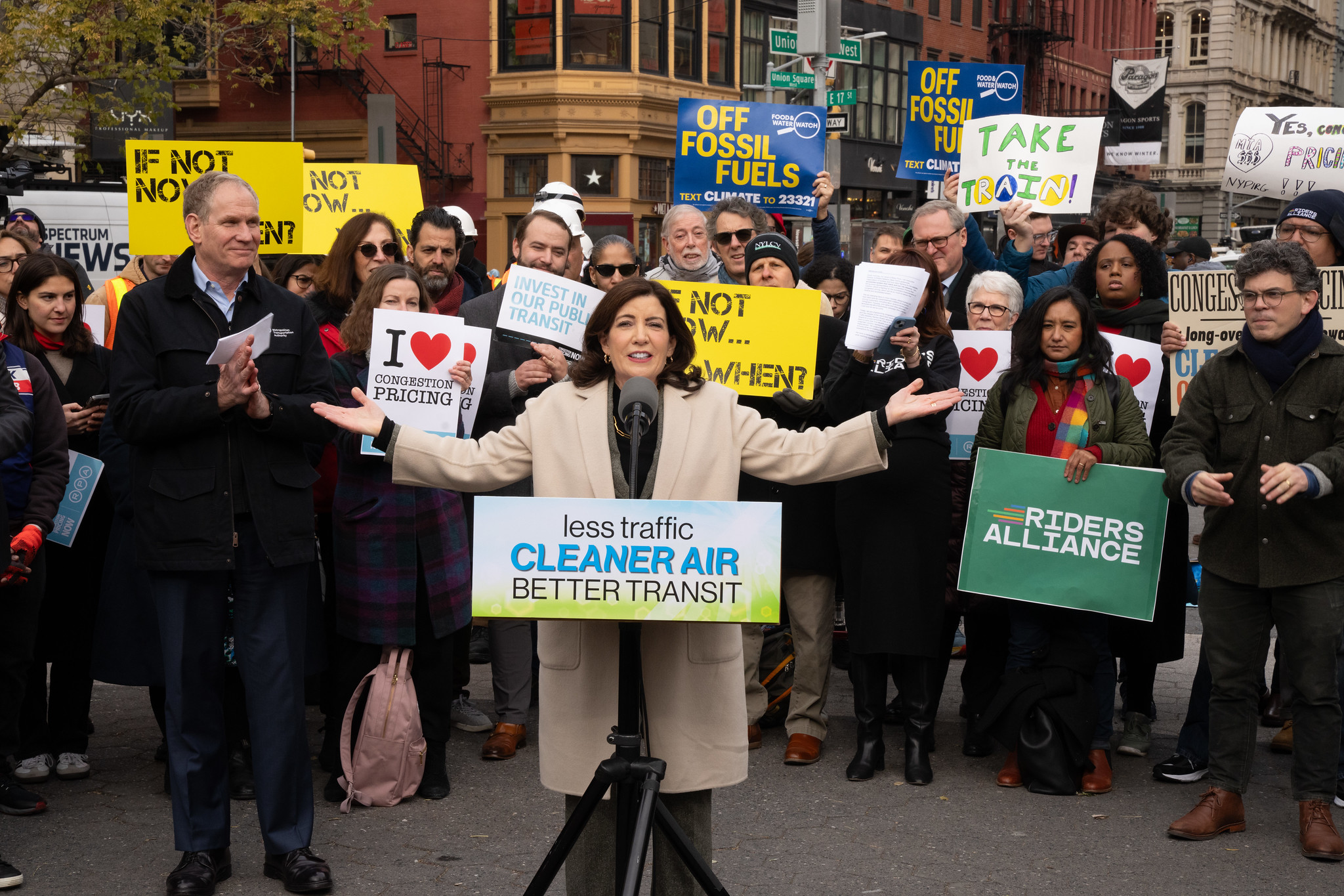 Gov. Kathy Hochul, flanked by MTA officials and demonstrators at a December 2023 event in support of congestion pricing.