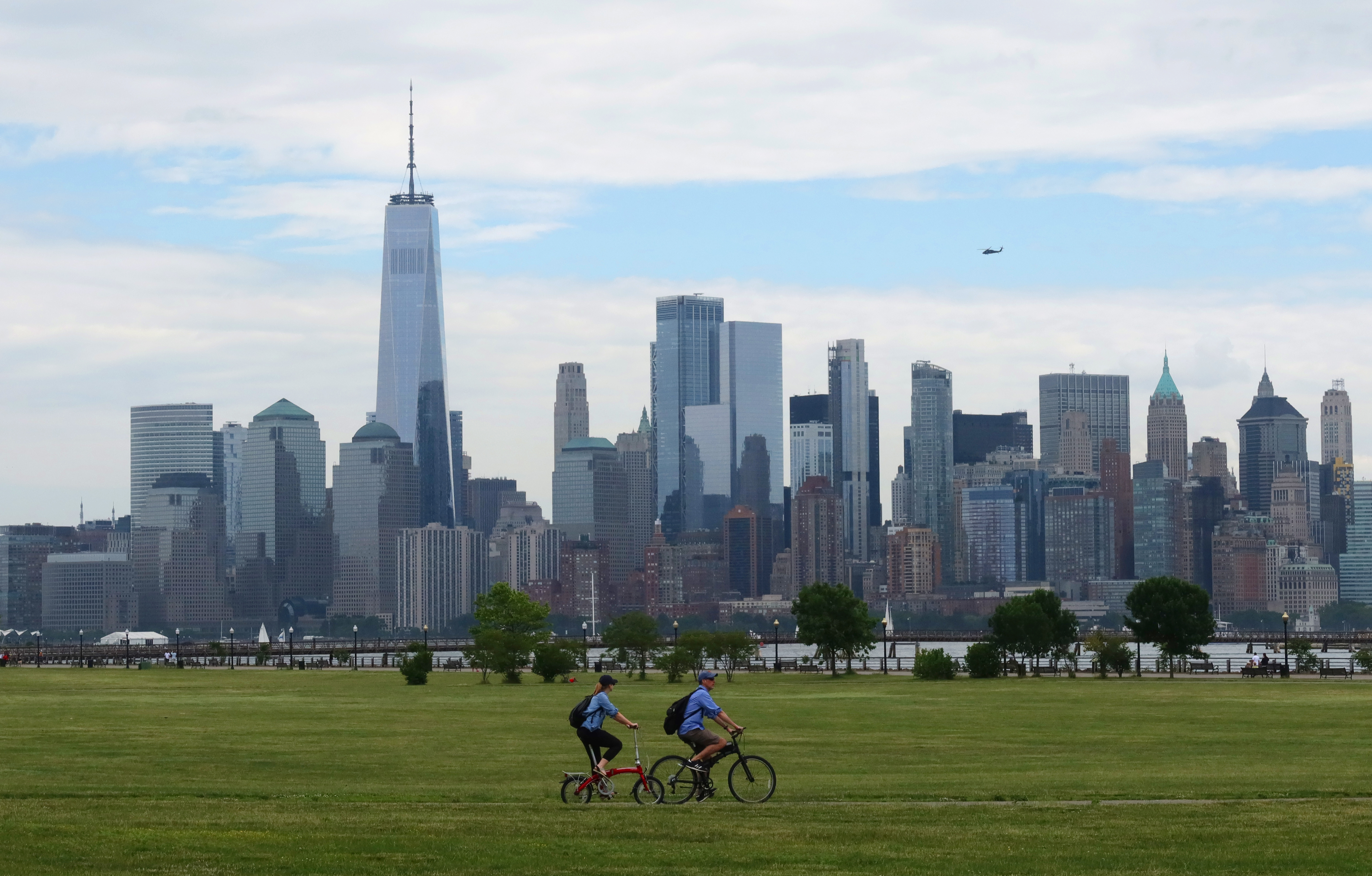 A photo of people bicycling near Manhattan