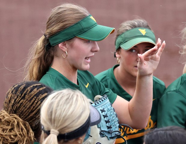 Waubonsie Valley's Hannah Laub talks with teammates between innings of the DuPage Valley Conference Tournament consolation game against Neuqua Valley at Northern Illinois University's Mary M. Bell Field in DeKalb on Thursday, May 16, 2024. (H. Rick Bamman / Naperville Sun)