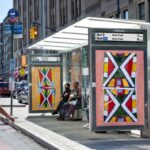 Rendering of a New York City bus shelter with a real-time bus arrival display