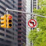 Traffic lights and a no left turn sign at a New York City intersection