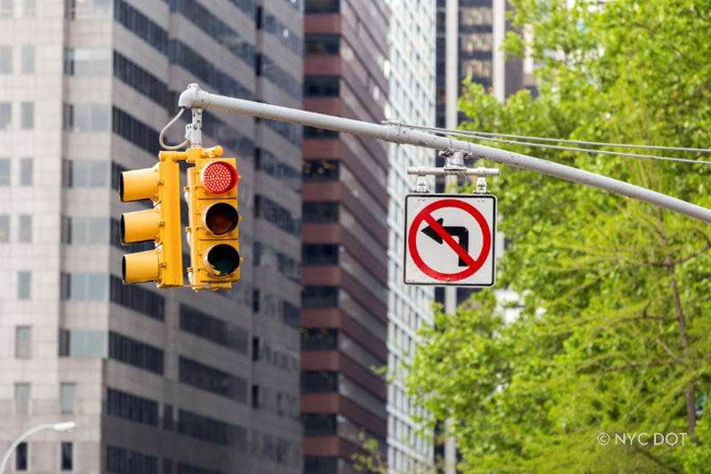 Traffic lights and a no left turn sign at a New York City intersection